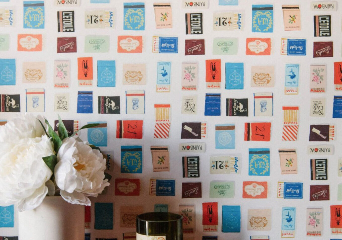 Wallpaper depicting a collection of painted matchbooks